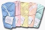 Pink Cuddle Bug Cloverleaf Swaddling Blanket. Uniquely designed, double-layer swaddling blanket for newborns and babies. Two layers of 100% cotton flannel. Front: Solid pink flannel; reverse: multi-colored juvenile-print flannel. Approximately 34 inches X 34 inches.