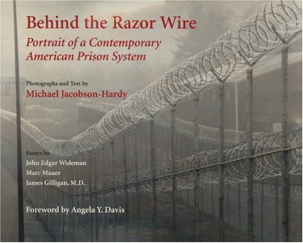 Behind the razor wire Cover